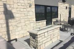 Custom linear fire pit. Stone: Cottonwood 2"-8" MSRV. Buff landscape coping.
