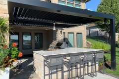 Pergola over custom grill island