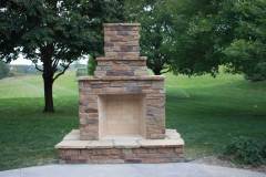 Firerock Outdoor Fireplace with Chablis Old Country Ledge Stone and Mahogany Flagstone wrap-around hearth.
