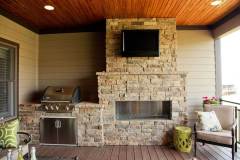 Napoleon Mirage Built-In Grill and Napoleon Outdoor Fireplace with Mahogany Prairie Stone.
